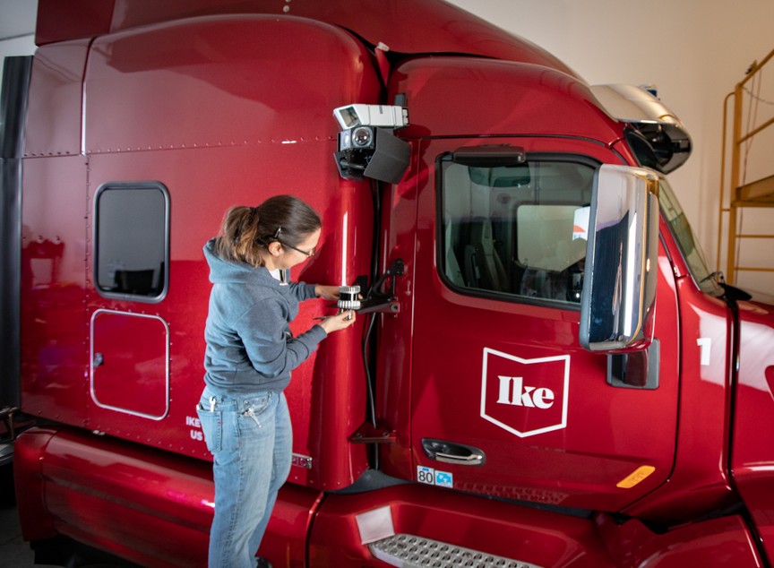 An Ike technician adjusts the Ouster lidar sensor on their autonomous truck
